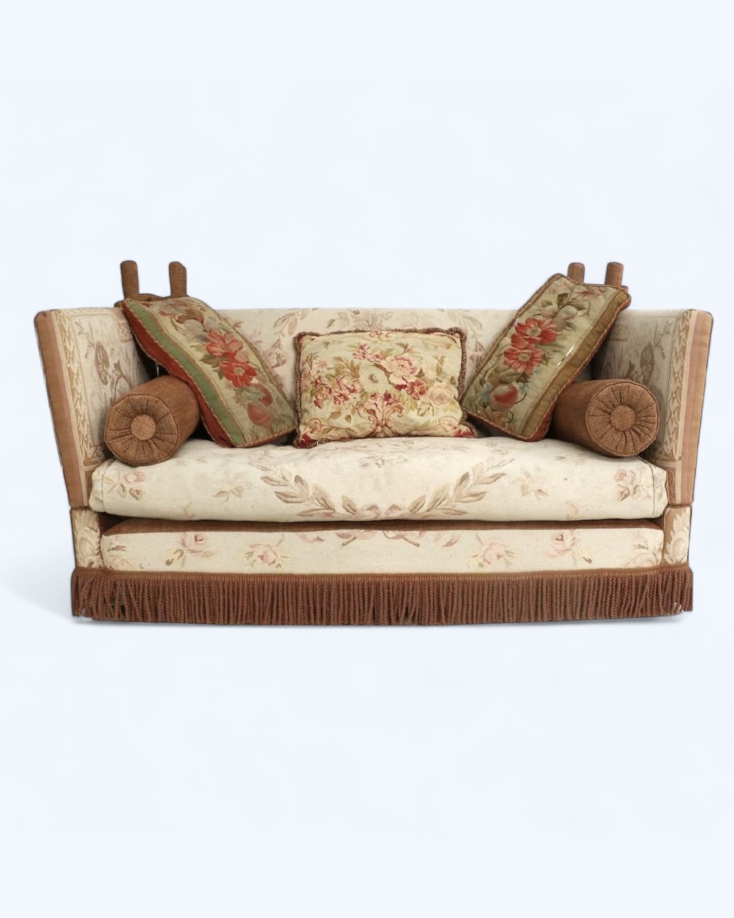 A feather-filled knole-style sofa