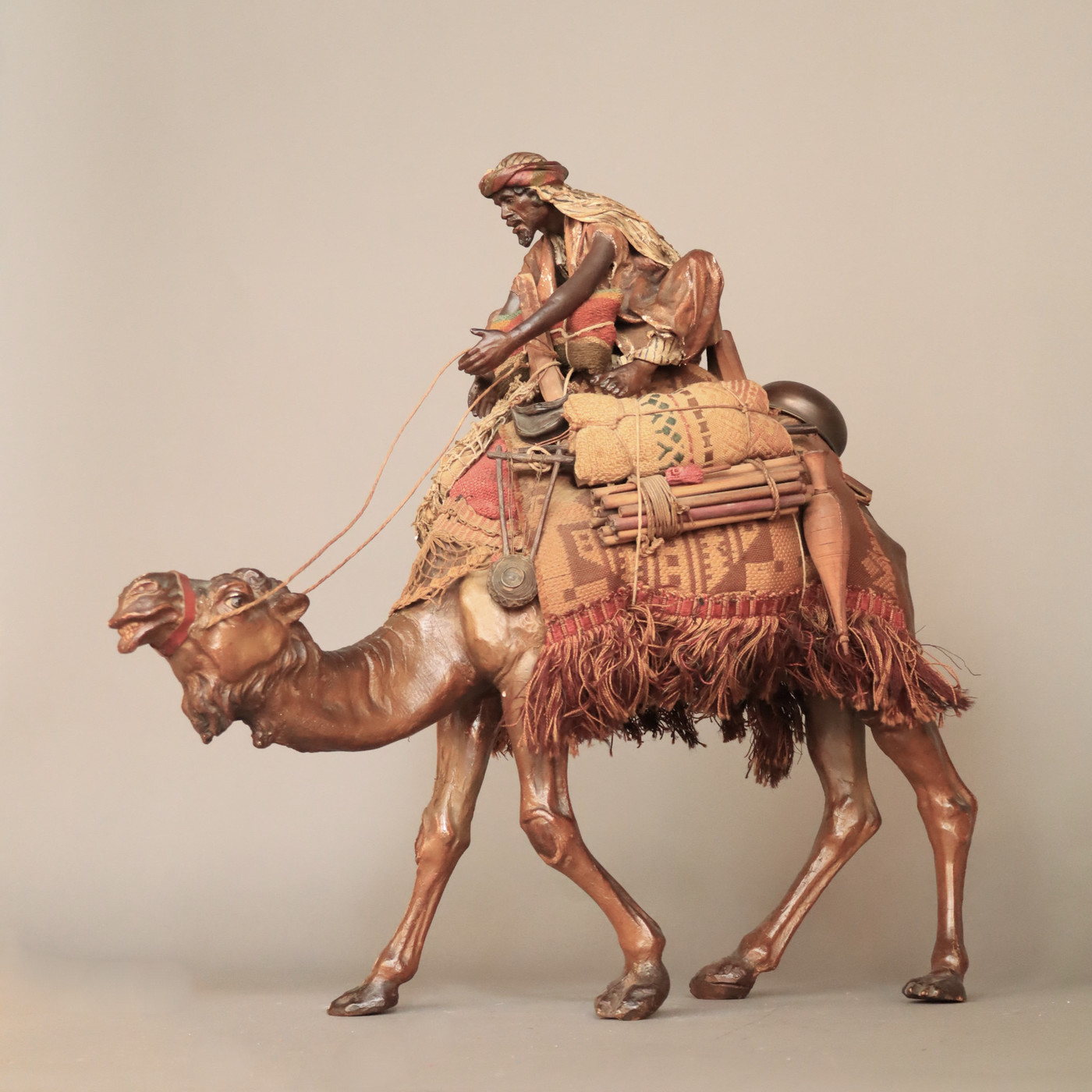 Arab on his camel, in pipe clay , in the manner of Angela Tripi,  circa 1900