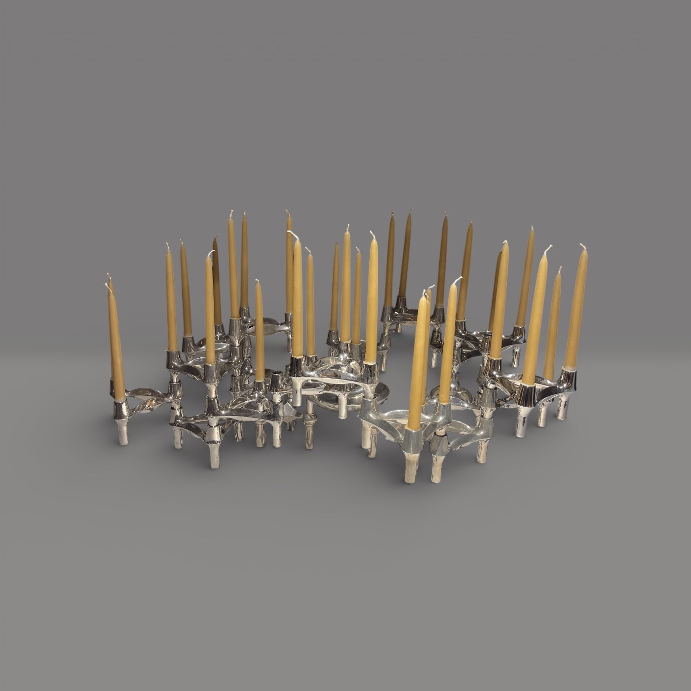Modular candle holder in chrome, consisting of 18 elements plus base. Designed by Werner Stoff for Hans Nagel, 1960s.