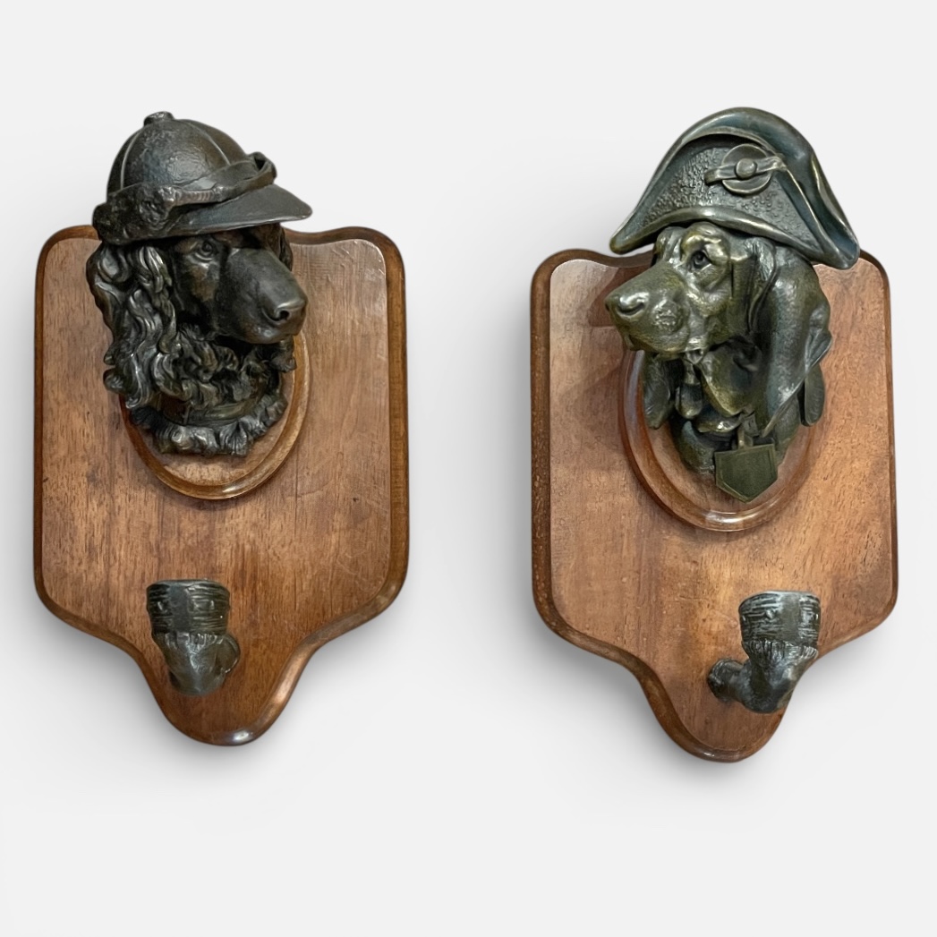 Pair of coat hangers with a bronze dogs head decorated