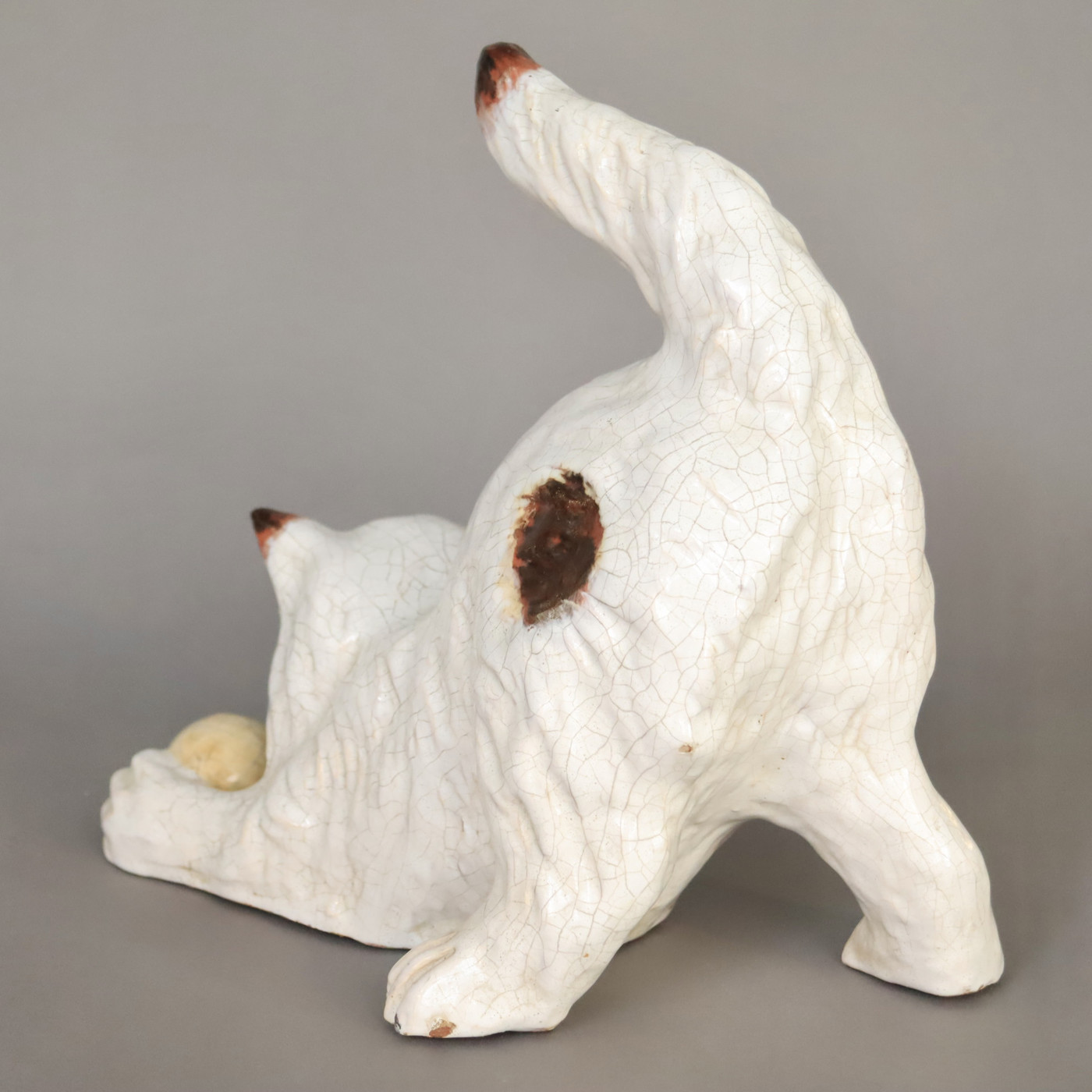 Playing cat in glazed terracotta made by 