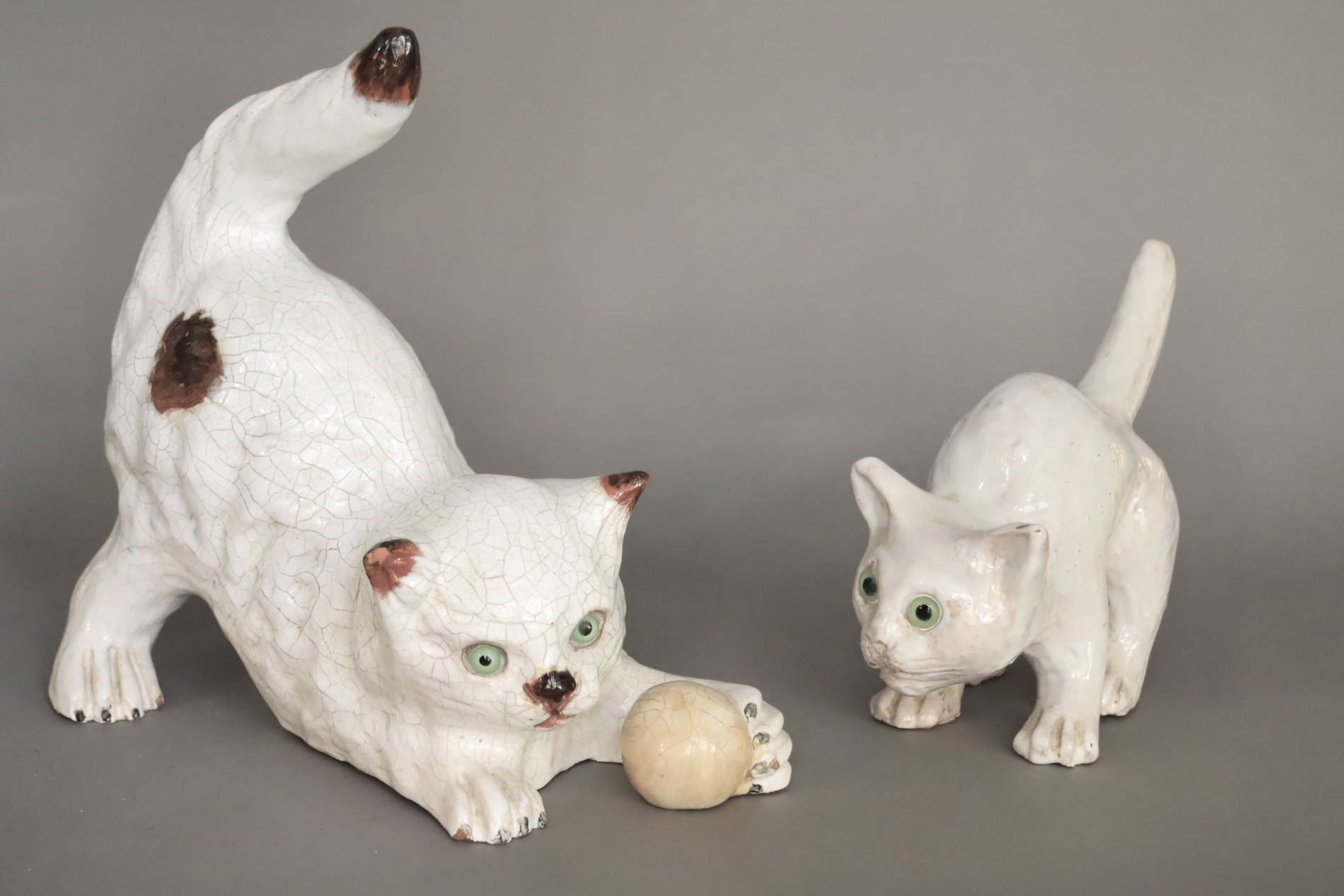 Playing cat in glazed terracotta made by 