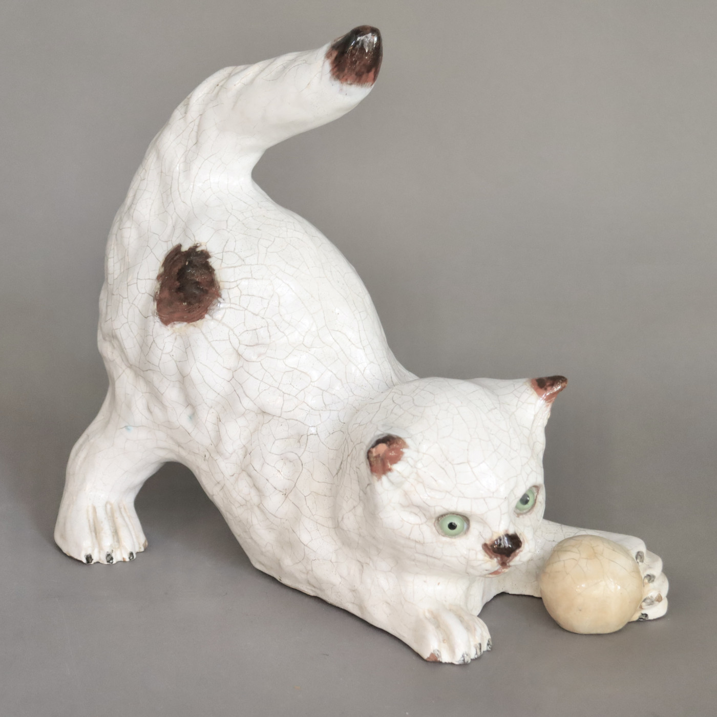 Playing cat in glazed terracotta made by 